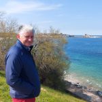 man standing by the coast